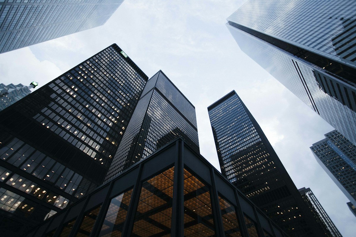 Looking up at the glass facades of company offices